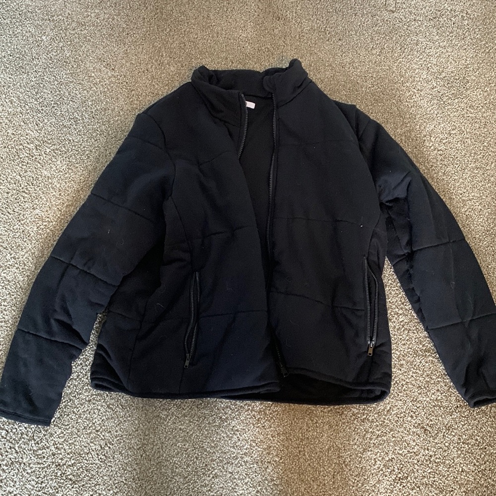 Black cotton puffy jacket. NOT WATER PROOF. Great for cold weather.
